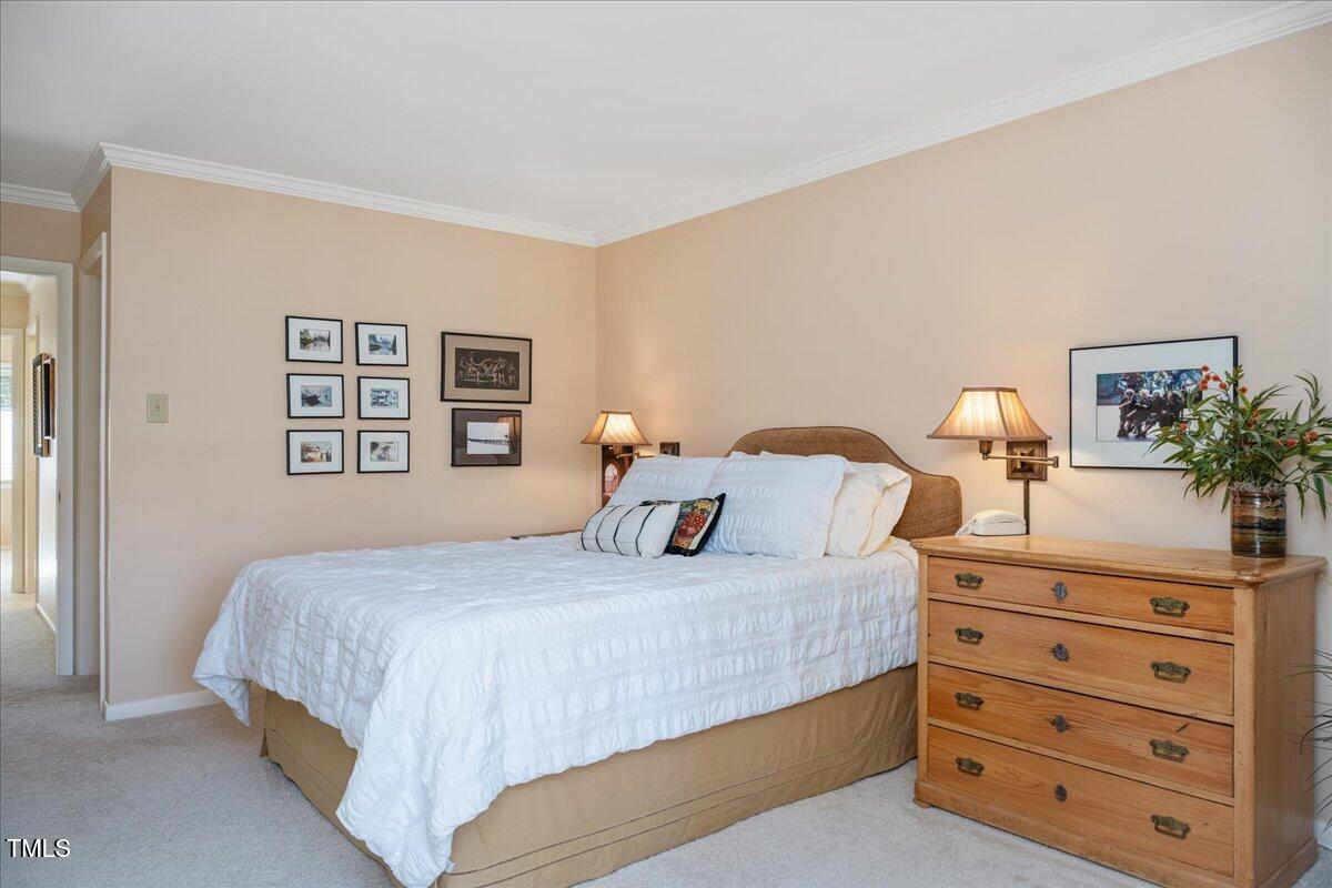 55 Stoneridge Road Durham, NC 27705 - Photo 6 of 35 a bedroom with a bed and a dresser
