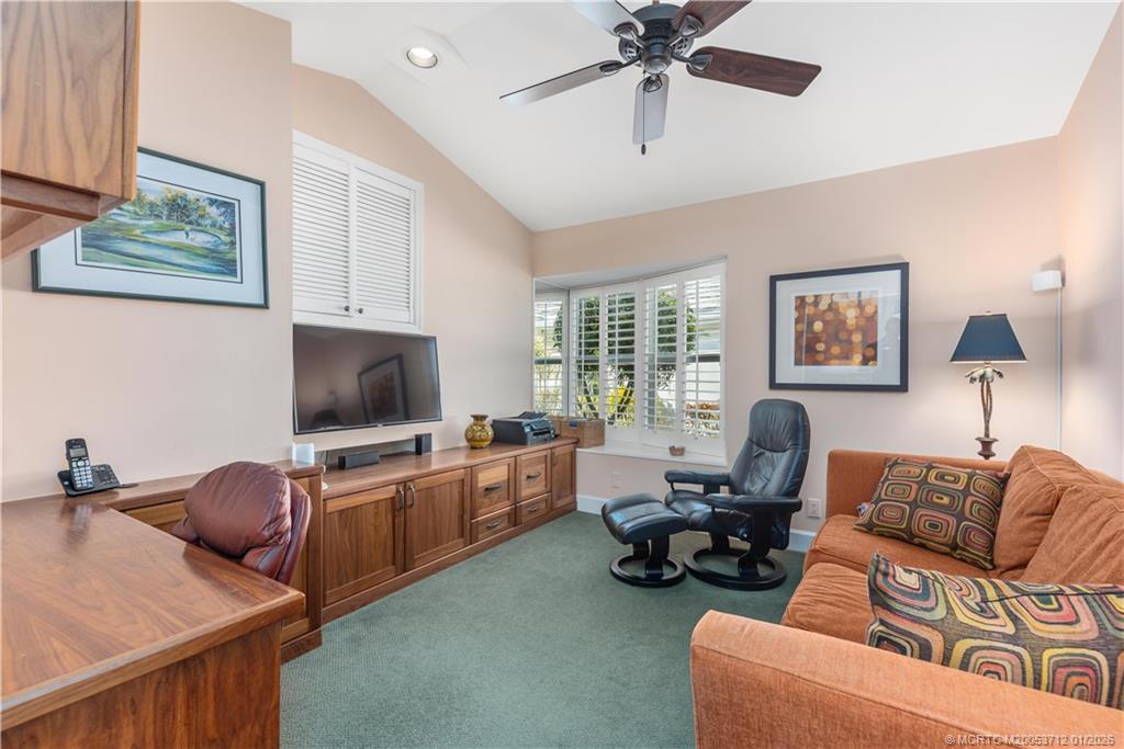 13265 Harbour Ridge Boulevard Palm City, FL 34990 - Photo 20 of 42 a living room with furniture and a flat screen tv