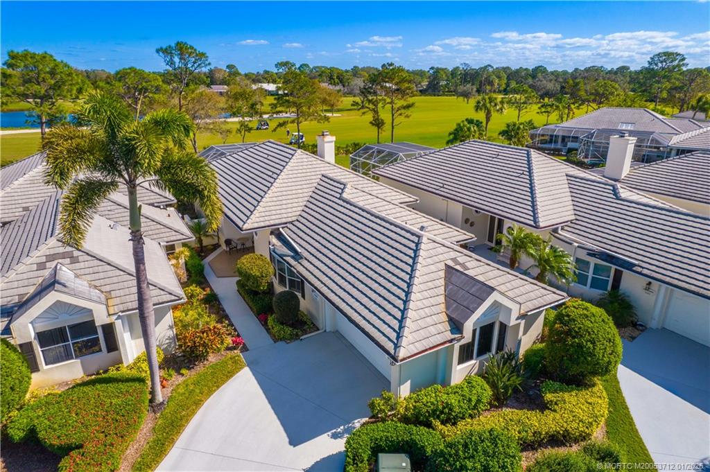 13265 Harbour Ridge Boulevard Palm City, FL 34990 - Photo 2 of 42 a view of a house with a yard and sitting area