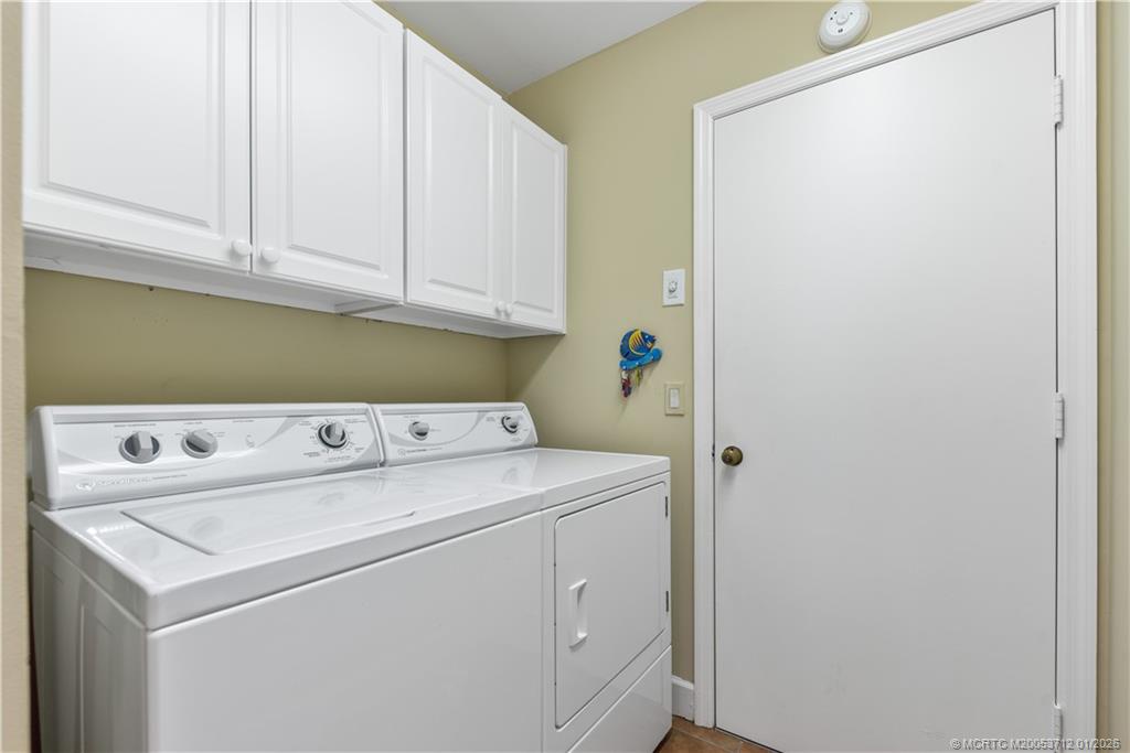13265 Harbour Ridge Boulevard Palm City, FL 34990 - Photo 22 of 42 a utility room with dryer and washer