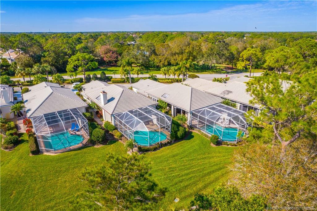 13265 Harbour Ridge Boulevard Palm City, FL 34990 - Photo 31 of 42 an aerial view of residential houses with outdoor space