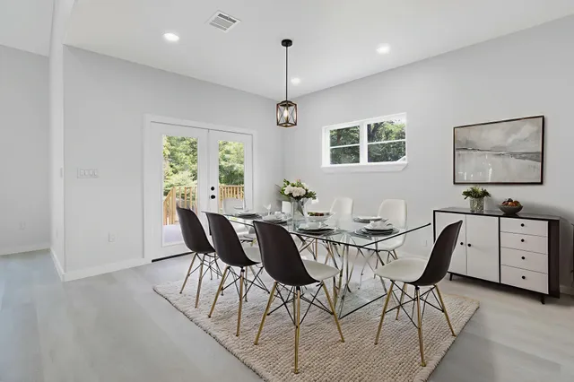 a view of a dining room with furniture window and wooden floor