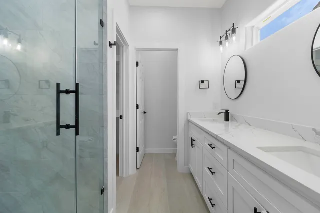 a bathroom with a double vanity sink double mirror