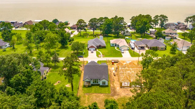 an aerial view of residential house with outdoor space and swimming pool
