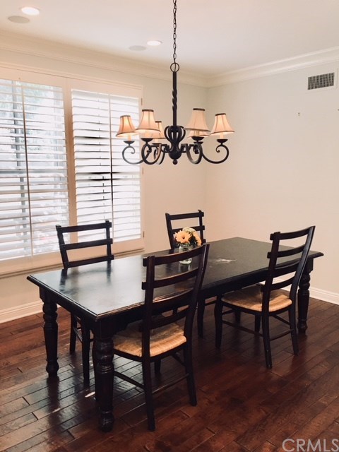 65 Old Course Drive Newport Beach, CA 92660 - Photo 6 of 15 Formal dining room with plantation shutters and hardwood floors makes dining a pleasure.