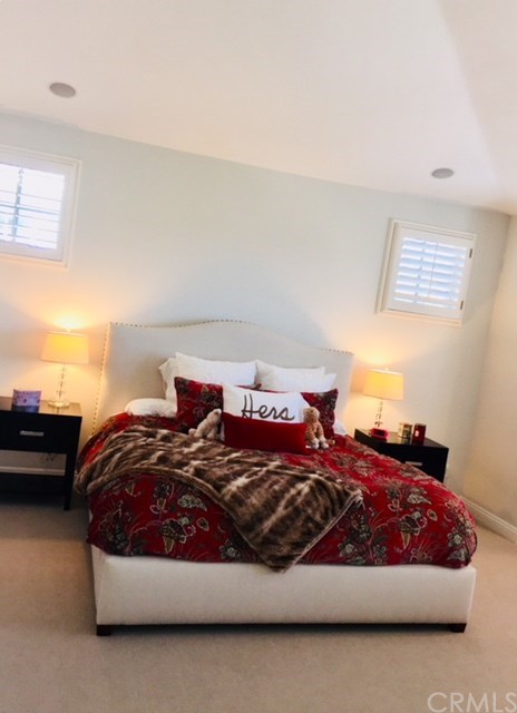 65 Old Course Drive Newport Beach, CA 92660 - Photo 7 of 15 Mater suite features vaulted ceilings, tons of light, a small office retreat and master bathroom with dual vanities, make-up vanity, separate shower and a soaking tub.