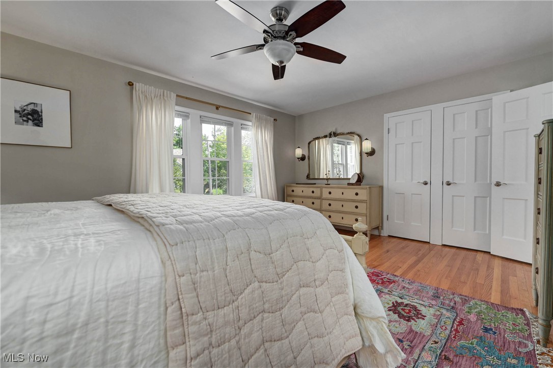 4022 Hillbrook Road Cleveland, OH 44118 - Photo 32 of 49 Bedroom with light wood-style floors, a closet, and ceiling fan