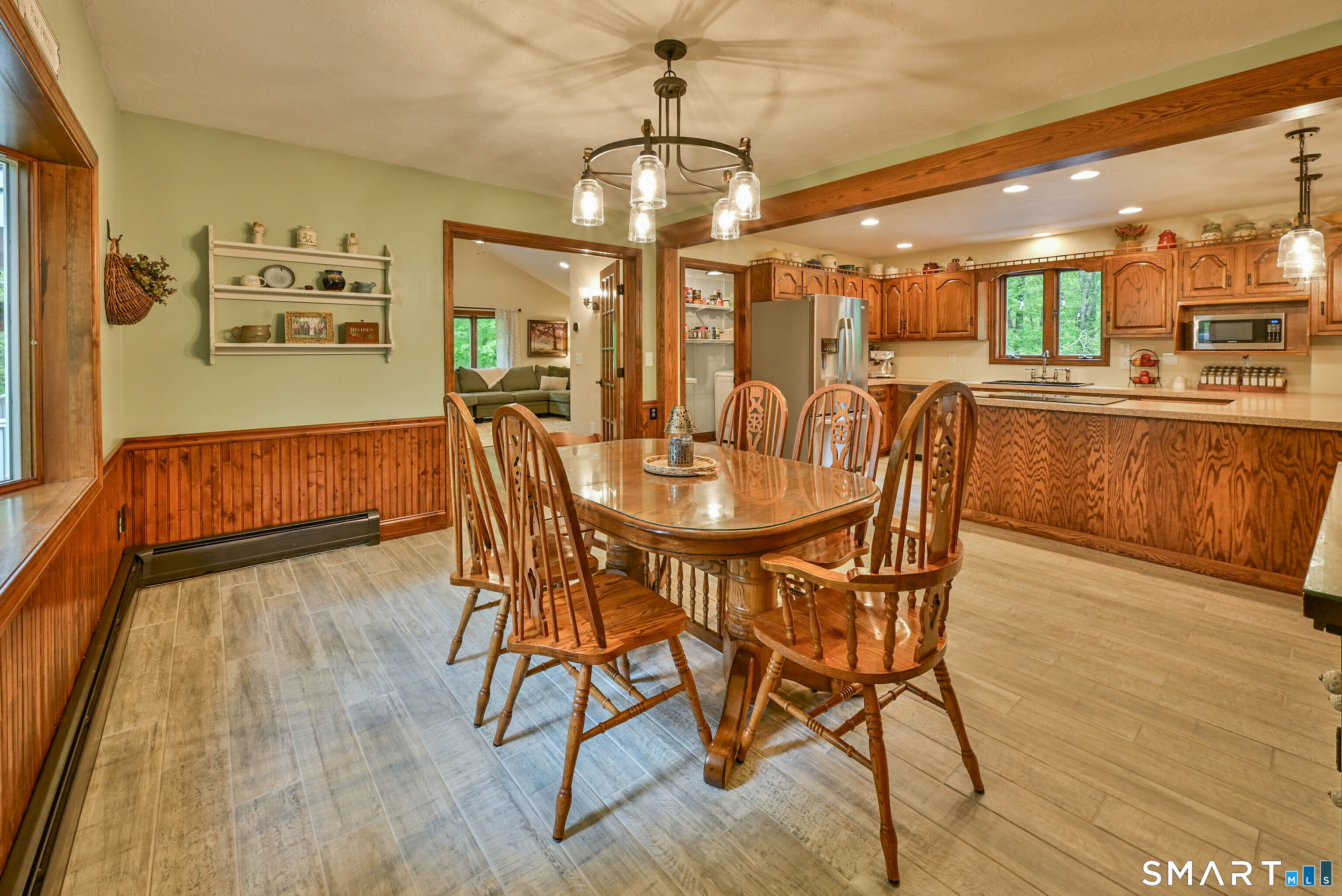 309 O'Leary Road Thompson, CT 06277 - Photo 22 of 40 a view of a dining room with furniture and wooden floor