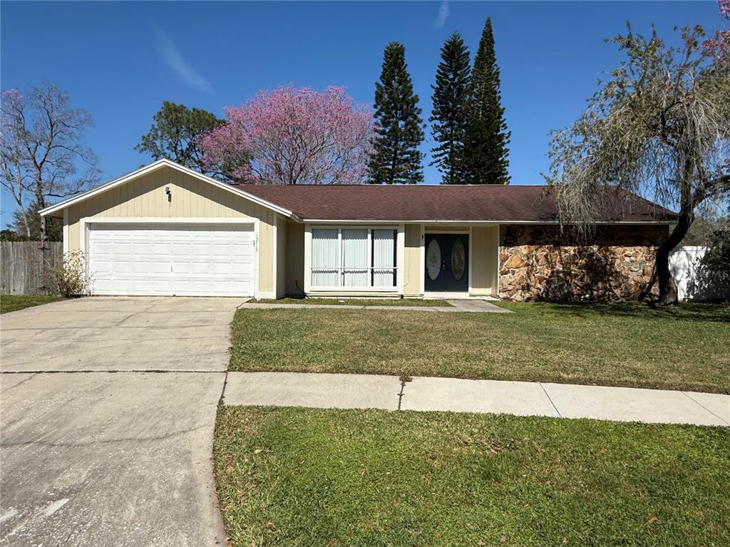 15713 Bovine Place Tampa, FL 33624 - Photo 1 of 1 a front view of a house with a yard