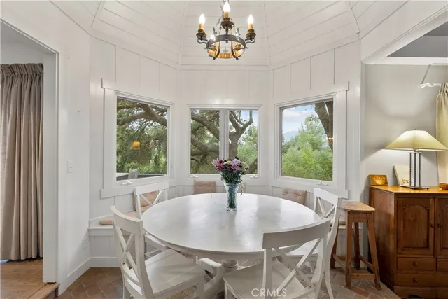 a living room with fireplace furniture and a wooden floor
