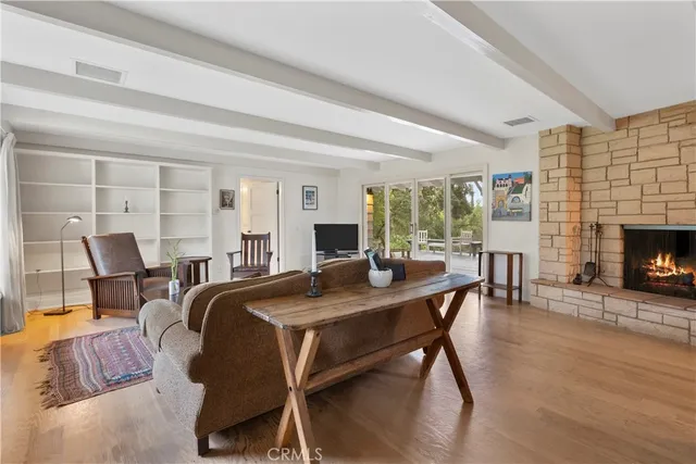 a view of a livingroom with furniture and a fireplace