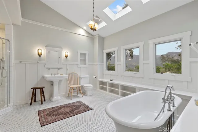 a view of a dining room with furniture a chandelier and wooden floor