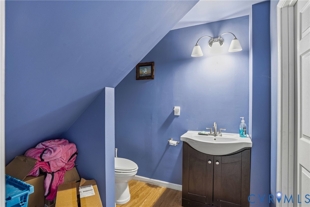 14219 Spruce Avenue Chester, VA 23836 - Photo 24 of 32 a bathroom with a sink toilet and a mirror