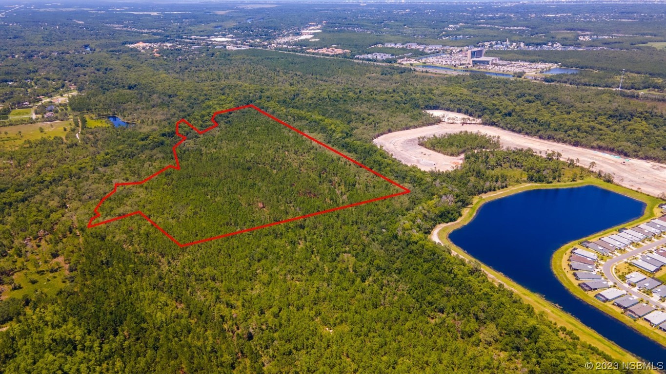 0 South Tymber Creek Road Ormond Beach, FL 32174 - Photo 10 of 24 an aerial view of residential houses with outdoor space and river
