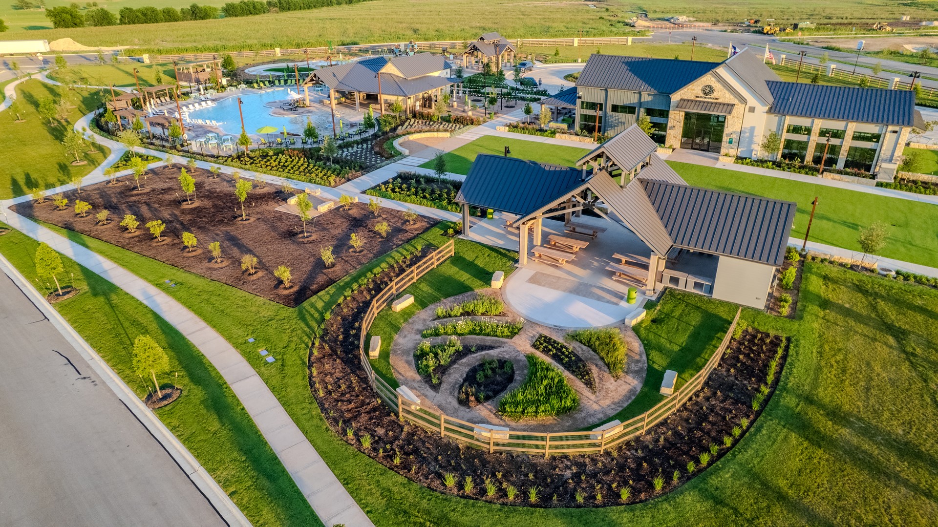 116 Bloomington Loop Hutto, TX 78634 - Photo 3 of 6 An aerial perspective reveals a vibrant community hub with inviting amenities and ample green space.