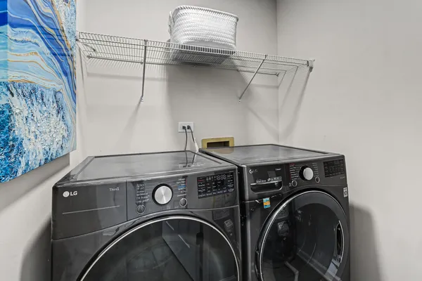 a utility room with dryer and washer