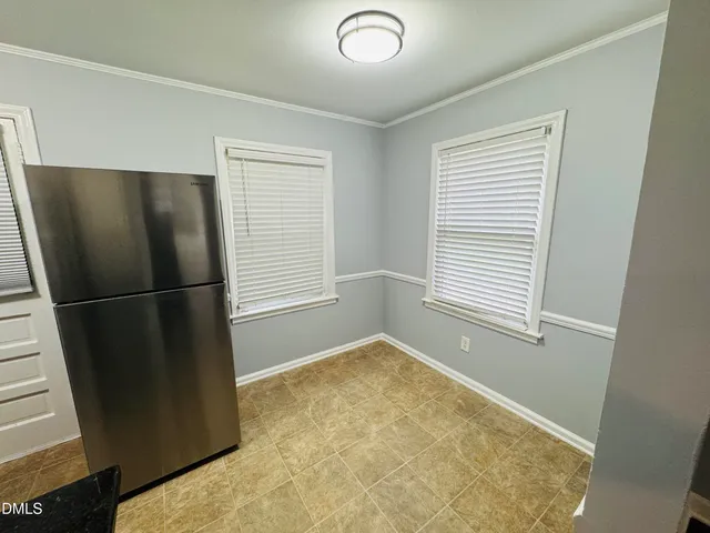 a view of empty room with front door