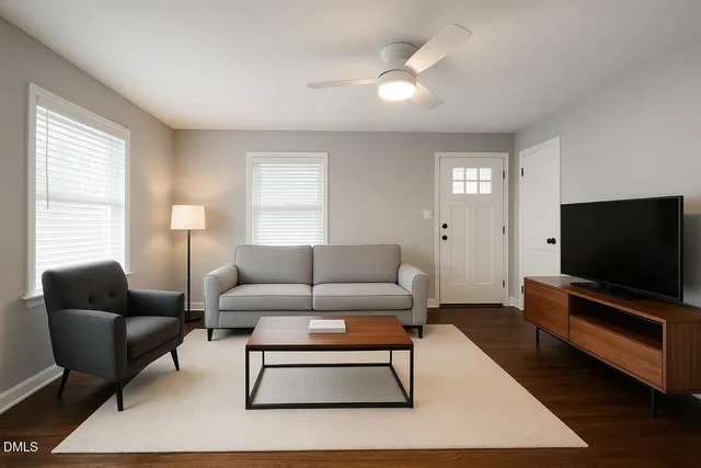 a living room with furniture and a flat screen tv