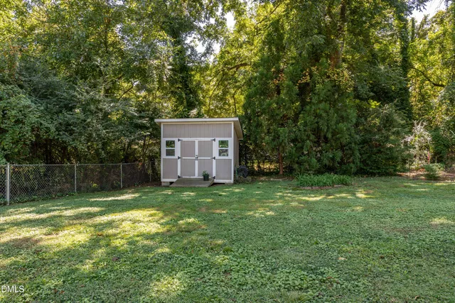 a backyard of a house with lots of green space