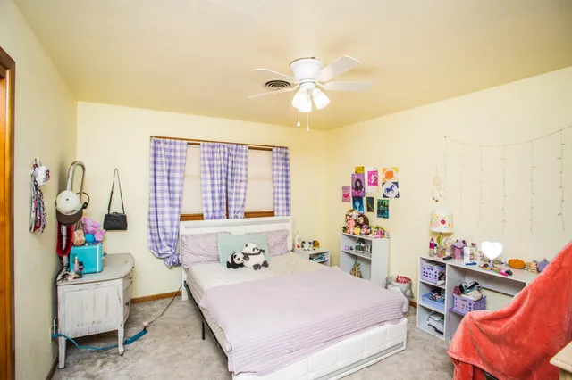 a bathroom with a tub mirror and sink