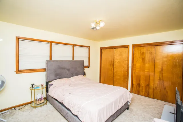 a bathroom with a sink vanity granite tub and shower