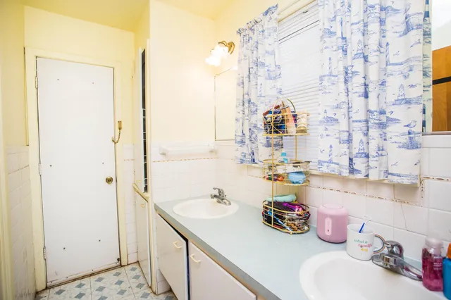 a bathroom with a sink and a shower
