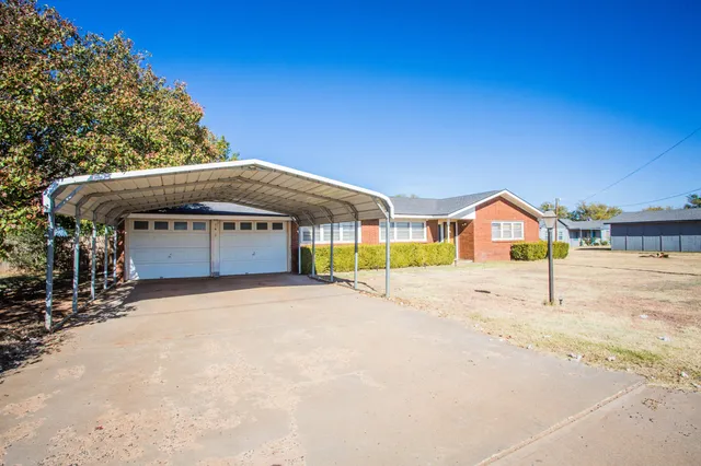 a view of an house with swimming pool and dinning table