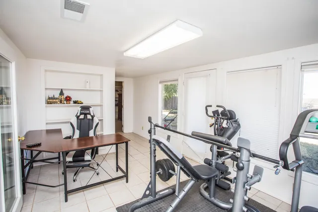 a swimming pool with outdoor seating and yard