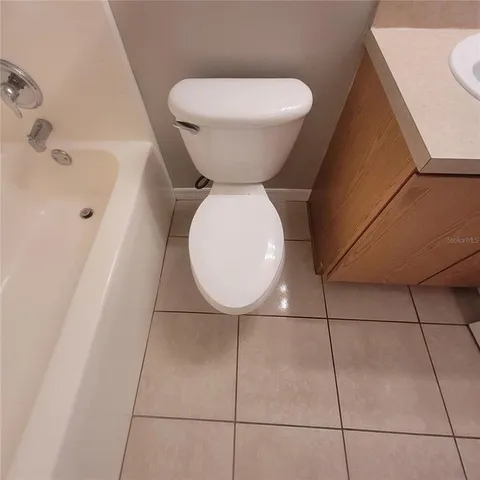 a bathroom with a sink and toilet