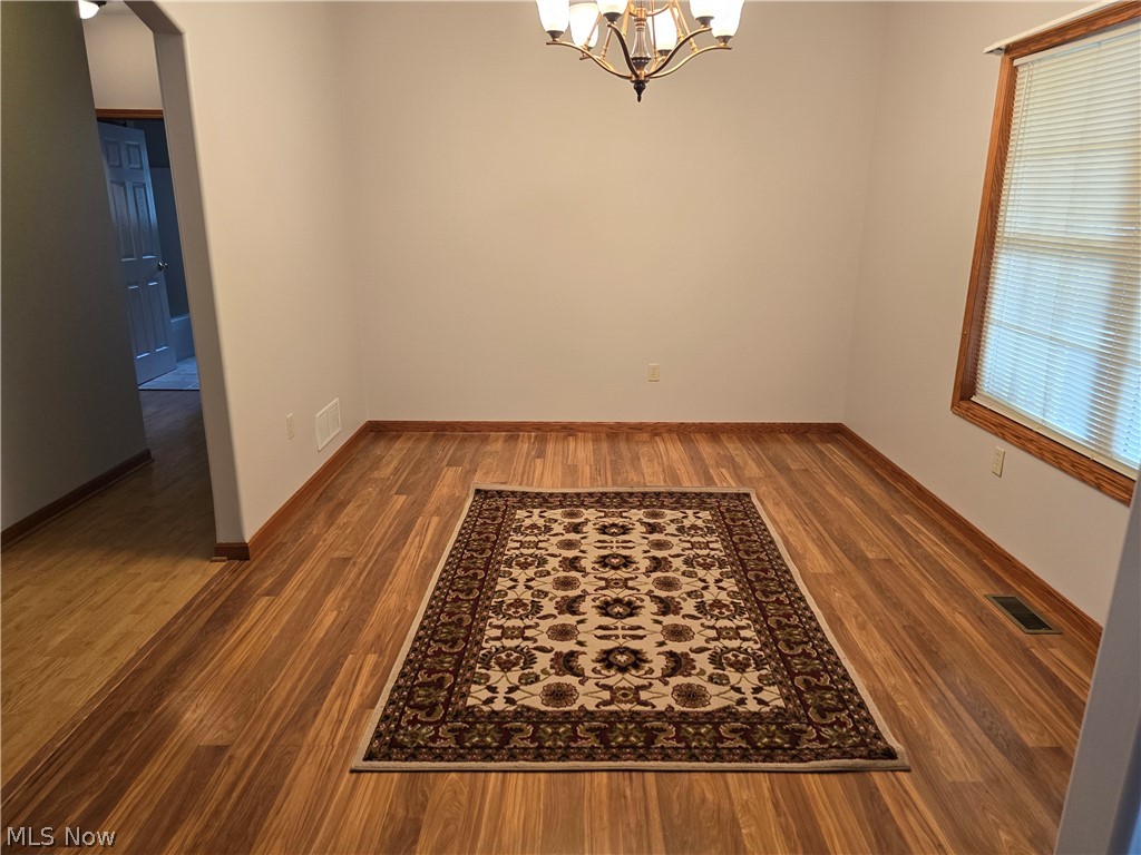 2680 Mayfair Road Akron, OH 44312 - Photo 5 of 25 Formal Dining Room with a notable chandelier