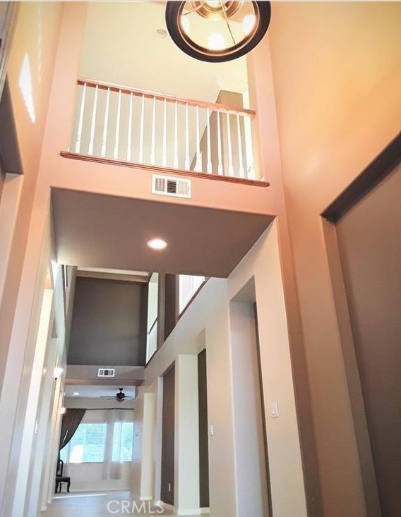 12701 Palm View Way Riverside, CA 92503 - Photo 12 of 26 a view of staircase with white walls and a window