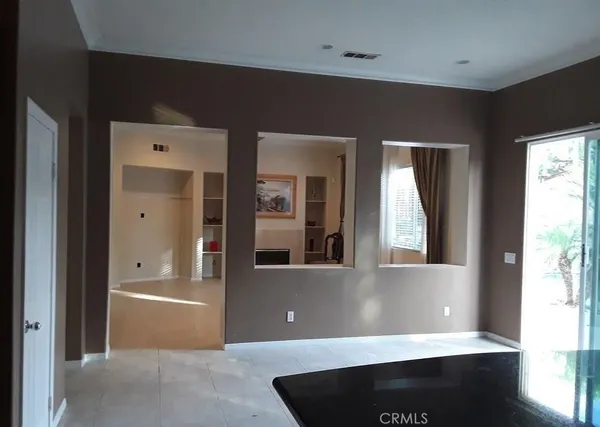 a view of a living room with a large window