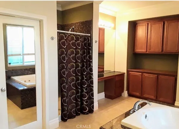 a bathroom with a bathtub and shower