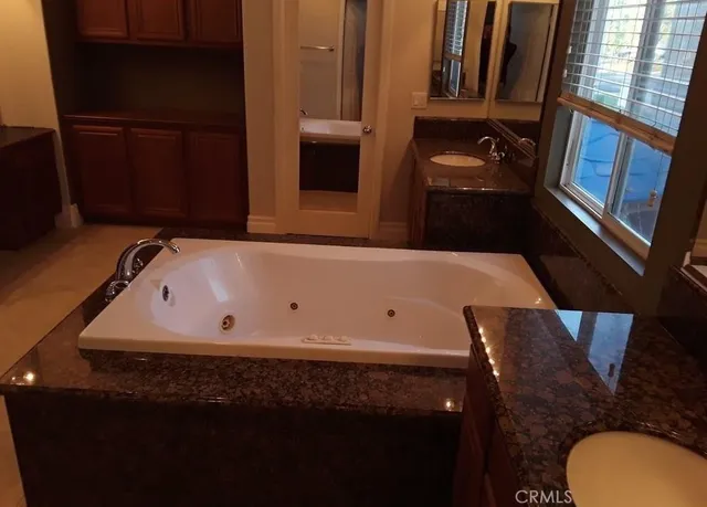 a bathroom with a bathtub and a sink