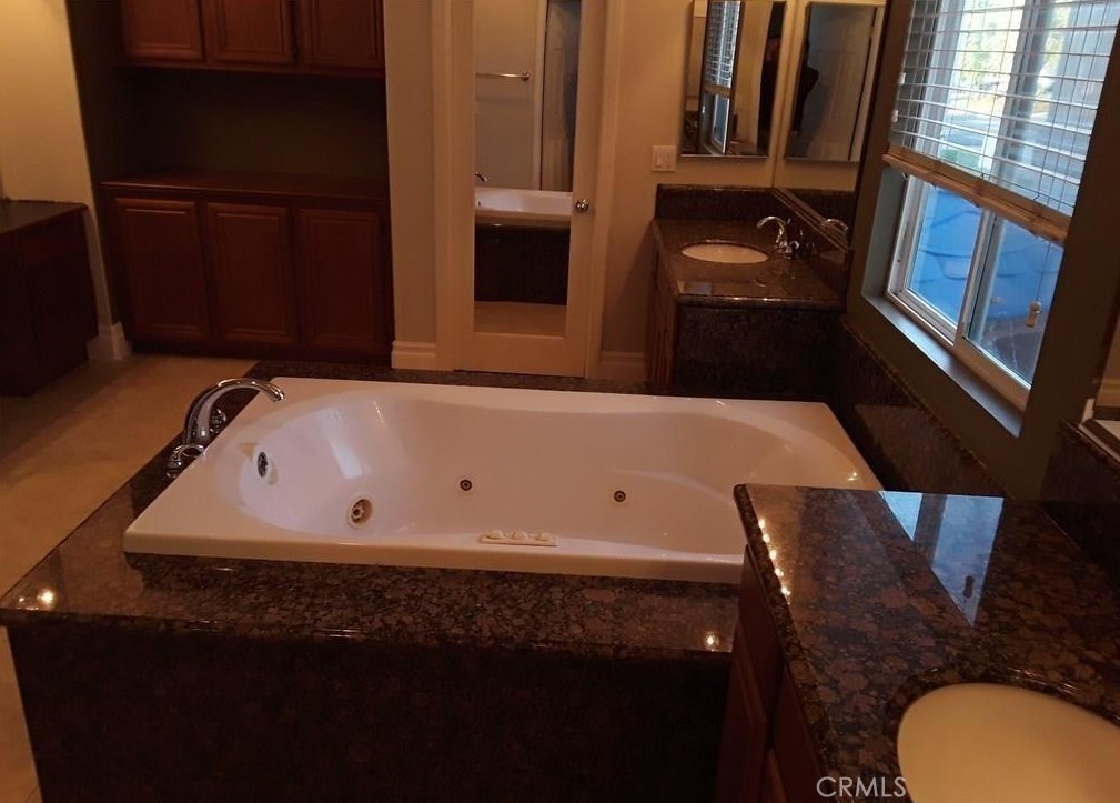 12701 Palm View Way Riverside, CA 92503 - Photo 20 of 26 a bathroom with a bathtub and a sink