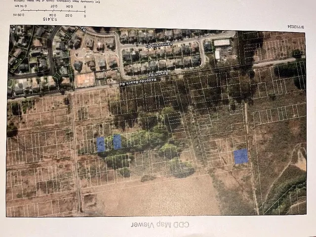 view of a bathroom with a shower and a door