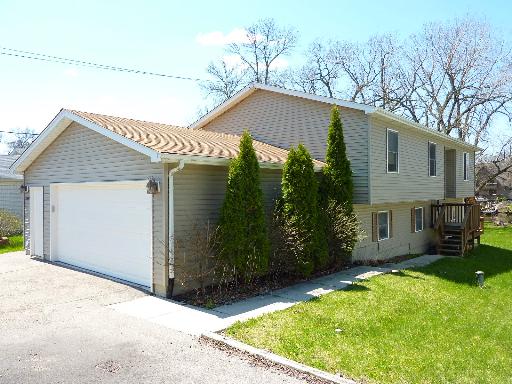 35480 North Wilson Road Ingleside, IL 60041 - Photo 1 of 1 a backyard of a house with plants and palm tree