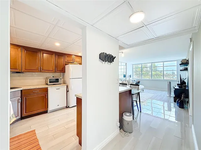 a kitchen with stainless steel appliances granite countertop a stove sink and cabinets