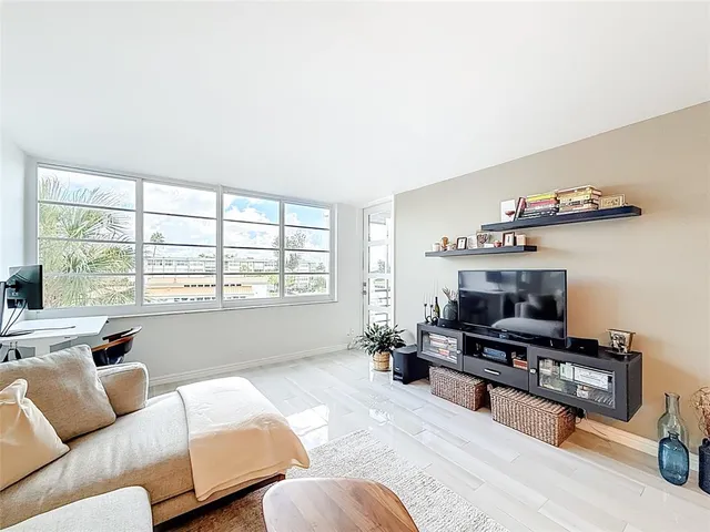 a view of a room with window and furniture