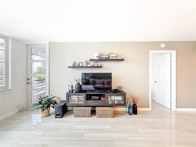 a bedroom with a bed and a night stand