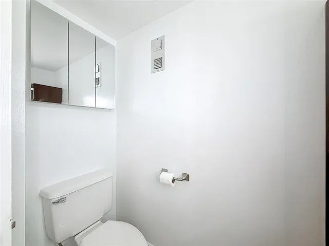 a cars parked in front of a blue building