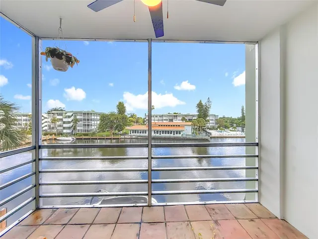 a view of a room with window and furniture