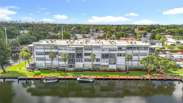 a front view of a building with a garden