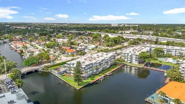 a view of a hallway with wooden shelves