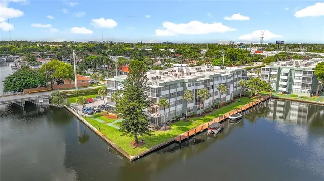 a kitchen with a refrigerator sink stove and cabinets