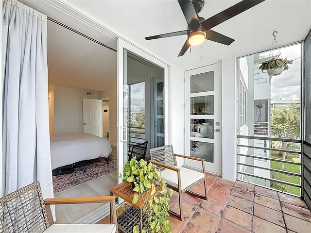 a kitchen with white cabinets stainless steel appliances and sink