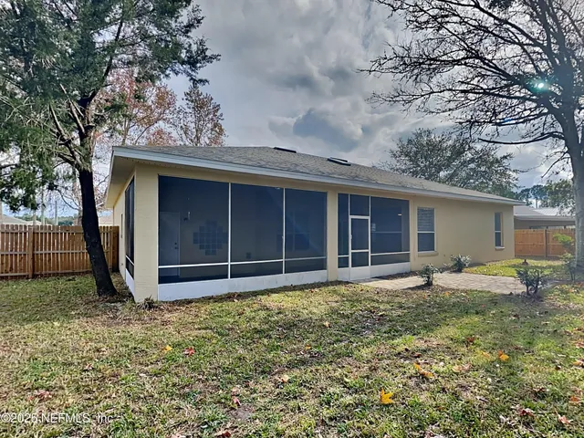 a house with trees in the background