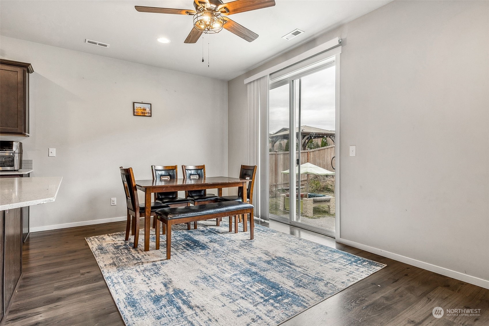 2926 Fiddleback Street Northeast Lacey, WA 98516 - Photo 11 of 29 a view of a dining room with furniture window and wooden floor