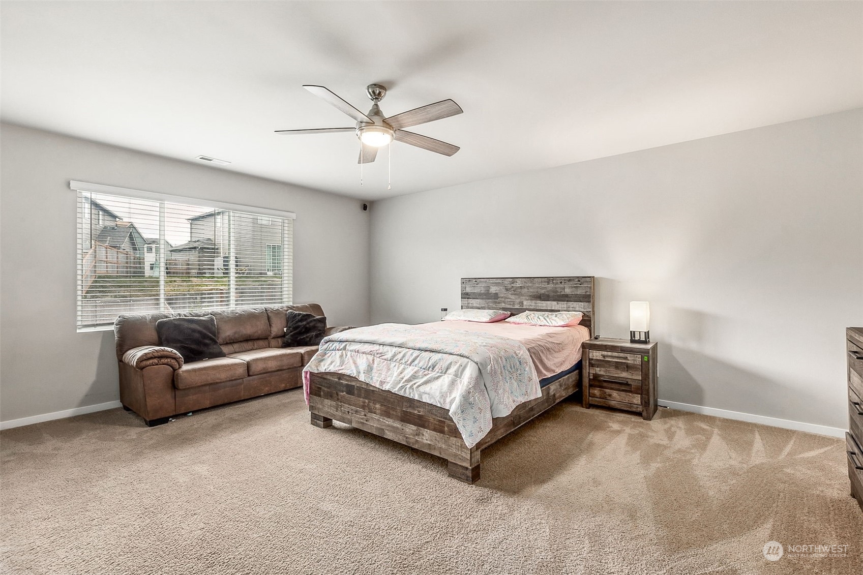 2926 Fiddleback Street Northeast Lacey, WA 98516 - Photo 13 of 29 a bedroom with a bed couch and window