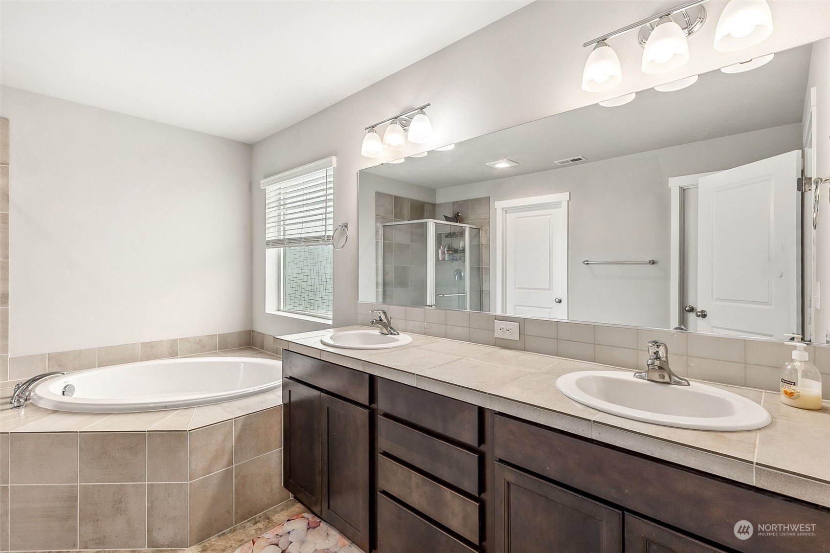 2926 Fiddleback Street Northeast Lacey, WA 98516 - Photo 15 of 29 a bathroom with a sink and a bathtub